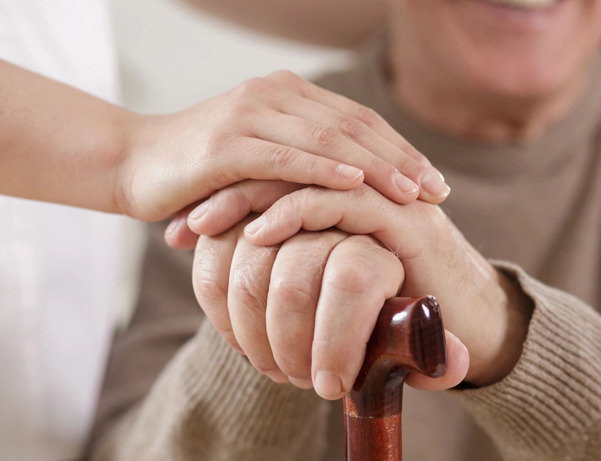 Nurse assisting ill elder patient